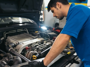 Professional Mechanic Repairing Car.