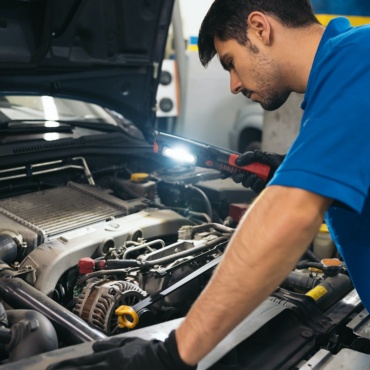 Professional Mechanic Repairing Car.