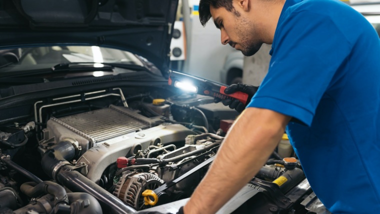 Professional Mechanic Repairing Car.