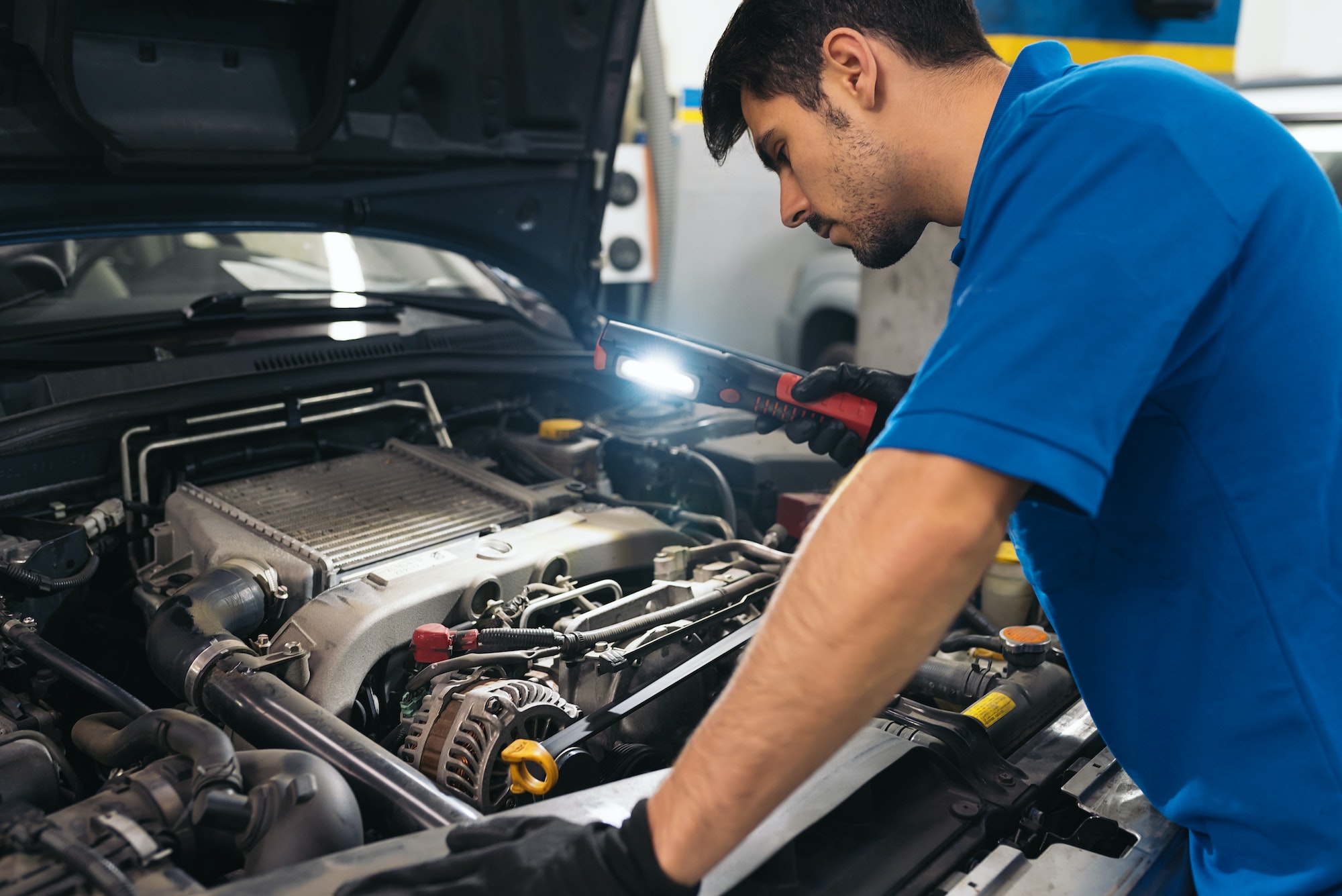Professional Mechanic Repairing Car.